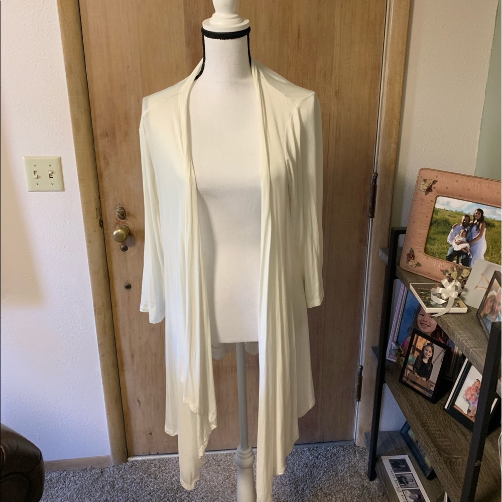 1X cream open cardigan. Sheer in back.